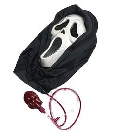 a black bag with a white mask in it and a red cord attached to it