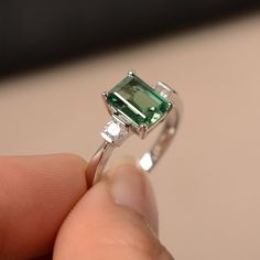 This is a gorgeous handmade creation. Its beauty is its simplicity & Elegance. The 6*8mm emerald cut lab green sapphire is crafted in solid sterling silver and with rhodium plated. All item is sent in a beautiful gift box You can realize more lovely stuff clicking the link https://www.etsy.com/shop/knightjewelry?refshopsection_shophome_leftnav Please leave the correct address and you phone number for delivering successfully. Sterling Silver Emerald Ring With Baguette Cut, Baguette Cut Emerald Ring In Sterling Silver, Sterling Silver Emerald Ring With Baguette Cut Center Stone, Square Cut Emerald Ring With Accent Stones For Wedding, Baguette Cut Emerald Ring With Center Stone, Green Sapphire Jewelry With Accent Stones, Green Sapphire Jewelry With Center Stone, Green Emerald Center Stone Ring In 14k White Gold, Sterling Silver Emerald Radiant Cut Promise Ring