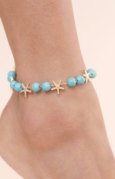 Online only! Enhance your beach style with Ettika's Starfish & Turquoise Beaded Anklet, adorned with turquoise beaded accents and playful starfish charms. This anklet adds a touch of coastal charm and bohemian elegance to your summer look.


	18k Gold Plated, Zinc, Reconstructed Turquoise
	8" with 1" extender
	Lobster Clasp Starfish-shaped Beaded Beach Jewelry, Adjustable Turquoise Jewelry With Star Charm, Blue Starfish Charm Anklet For Vacation, Blue Anklet With Starfish Charm For Vacation, Blue Anklets With Starfish Charm For Gift, Turquoise Beaded Bracelets With Starfish Charm, Blue Anklets With Starfish Charm As Gift, Bohemian Turquoise Starfish Beaded Bracelets, Blue Beach Anklets