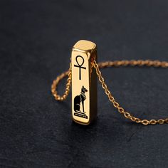 "This Gold Egyptian Cat Goddess Necklace is made of high-quality components - the American-made strong gold-plated steel chain and the beautiful, expensive-looking 24K gold-plated bar pendant, finished off with a larger lobster clasp for your convenience. The pendant engraving is permanent and will not wear off. You can easily customize this necklace by choosing different chain lengths, adding an initial letter charm, or a dangling birthstone. Also, you can choose to personalize this necklace by adding a text engraving to it. The available chain length - 14\", 16\", 18\", 20\", 22\", 24\" The pendant size: 30 mm in height, 7 mm wide ADD INITIAL CHARMS: https://www.etsy.com/listing/1188728114 ADD DANGLING BIRTHSTONES: https://www.etsy.com/listing/690860375 For more of the Egypt theme jewelr Egyptian Goddess Jewelry, Bast Goddess, Egyptian Cat Goddess, Gold Bar Pendant, Cat Goddess, Egypt Jewelry, Symbol Jewelry, Ancient Egyptian Jewelry, Egyptian Necklace