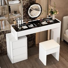 there is a vanity table with a mirror and stool in front of the counter top