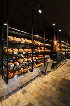 a bakery filled with lots of different types of bread