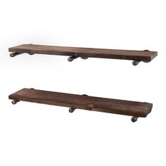 two wooden shelves with wheels on them