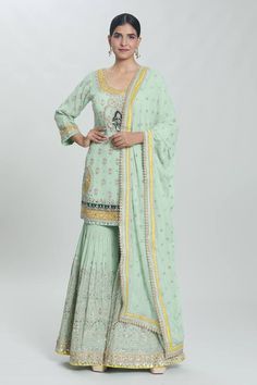 Green padded kurta with sequin pearl embellished, floral paisley zardozi embroidered patterns. Comes with can can attached sharara and dupatta. - Aza Fashions Semi-stitched Pista Green Sharara With Dabka Work, Pista Green Semi-stitched Sharara With Dabka Work, Festive Pista Green Sharara With Dabka Work, Unstitched Pista Green Sharara In Chinon, Semi-stitched Pista Green Chinon Palazzo Set, Pista Green Sharara With Dabka Work And Traditional Drape, Pista Green Sharara With Dabka Work, Designer Pista Green Sharara With Zari Work, Pista Green Georgette Palazzo Set With Zari Work