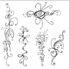 an artistic tattoo design with swirls and flowers on the back of each piece of paper