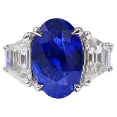 It comes with the appraisal by GIA GG/AJP Blue Sapphire = 2.03 Carat Cut: Oval 2 Diamonds = 0.62 Carats ( Color: G-H, Clarity: SI ) Metal: 18K White Gold Ring Size: 7* US *It can be resized complimentary Contemporary Engagement Rings, Modern Engagement Rings, Blue Sapphire Ring, Modern Ring, Blue Sapphire Rings, Natural Blue Sapphire, Sapphire Stone, Three Stone Rings, Love Ring