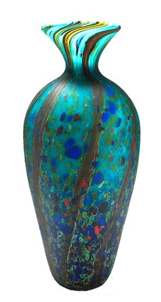 a blue vase with multicolored designs on the outside and inside, against a white background