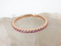 This feminine light pink sapphires eternity band is the perfect complement to any engagement ring or as stackable bands. *Based on ring size 6.5 *Metal: 18K Rose Gold *Stones: Genuine Sapphires *Color: Light Pink *Stone Count: 44 PCS *Weight: 0.43cts T.W *Band Width: 1.5mm ( +/- 0.1mm in variation) ---------------------------------------- Carat weight & stone count varies depending on the ring size. ---------------------------------------- Beautiful Ring Box Included ------------------------ Rose Gold Stackable Rings With Prong Setting, Rose Gold Stackable Rings With Pink Sapphire For Anniversary, Rose Gold Pink Sapphire Stackable Rings For Anniversary, Anniversary Rose Gold Stackable Rings With Pink Sapphire, Pink Stackable Half Eternity Rings As Gift, Pink Half Eternity Stackable Rings, Pink Round Cut Stackable Eternity Band, Pink Half Eternity Round Band, Stackable Pink Sapphire Jewelry With Round Band