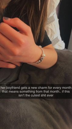 a woman with her hand on her arm and the caption says, her boyfriend gets a new charm for every month that means something from that month