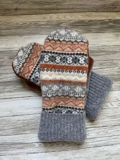 Upcycled wool sweater mittens. These cozy mittens are perfect for cold winter days. This pair is made from four different sweaters I washed in hot water to felt.  The inside is lined with cozy warm fleece.  This pair would fit most women's  hands. Measurement are 9.5 inches top to bottom and 4.5 inches wide.  Each pair is a one of a kind creation  Hand wash and lay flat to dry Looking for a certain color?  Send me a note and I will create a pair for you! Mittens were made from a pattern from  ww Sweater Mittens, Recycled Sweaters, Wool Mittens, Mittens Pattern, Winter Days, Winter Day, Mitten Gloves, Wool Sweater, Cold Winter