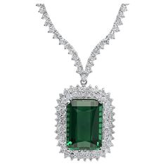 29.20Ct Natural Tourmaline and Diamond 18K Solid White Gold Necklace Natural Tourmaline Weights: Approx. 20.90 Carats Tourmaline Measures: Approx. 10 x 8 mm Total Natural Round Diamond weights: Approx. 8.30 Carats (color G-H / Clarity SI1-SI2) Total Chain Length is 18 inches Total item weight is: 25 grams Disclaimer: all weights, measurements and colors are approximate and may vary slightly from the listed dimensions or as seen in the image. All pictures are magnified to show the smallest of det Exquisite Diamond And Emerald Formal Necklace, Exquisite Diamond Emerald Necklace For Formal Occasions, Luxury Emerald Gemstone Necklace For Formal Occasions, Exquisite Emerald Necklace With Diamonds For Formal Events, Formal Emerald Diamond Necklace In White Gold, Emerald Diamond Necklace For Formal Occasions, Dazzling Formal Emerald Gemstone Necklace, Formal Emerald Necklaces With Diamond Cut, Luxury Emerald Pendant Necklace For Formal Occasions