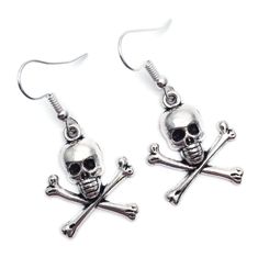 Dangly earrings with silver tone skull and bones charms. The earrings are ca 40mm (1.57 inches) long including hooks. Silver coloured hooks that comply with strict regulations for low nickel and lead content in jewellery. Skull-shaped Metal Earrings With Ear Wire, Nickel Free Metal Skull Earrings, Metal Skull Earrings With Ear Wire, Silver Skull Earrings With Ear Wire, Skull And Crossbones, Dangly Earrings, Skull And Bones, Charm Earrings, Silver Charms