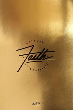 a golden metallic plate with the word faith on it's side and black lettering