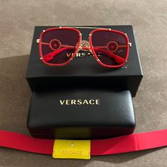 The Renowned Versace Eyewear Brand Features Contemporary Shapes And The Iconic Emblem Of The Brands Own Mythology The Medusa. These Sunglasses Are Pink Throughout With Gold Metal Framing. On Each Side Is The Signature Versace Emblem Made With Gold Metal Trimming. These Are Square Full Rim Frames That Are Best For Oval Square Faces. This Frame Is Not Compatible With Prescription Lenses. Eye/Bridge/Temple Width: 61/18/145 Luxury Red Square Frame Sunglasses, Luxury Red Sunglasses For Party, Luxury Red Sunglasses For Formal Occasions, Black Sunglasses Women, Versace Shades, Contemporary Shapes, Versace Bag, Mirrored Aviators, Versace Pink