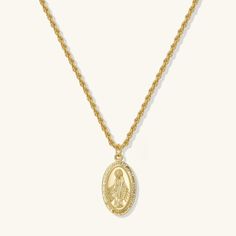 Make a statement with our Virgin Mary necklace. This necklace has a Virgin Mary pendant strung with a rope twist chain and a lobster clasp closure. - Made in 18k gold plating- Pendant size: 12 x 19 cm.- Adjustable chain 16 to 18 inches Virgin Mary Necklace Aesthetic, Gift Medallion Necklace With Rope Chain, Virgin Mary Pendant, Preppy Things, Necklace Aesthetic, Mary Necklace, Virgin Mary Necklace, Rope Twist, Religious Cross