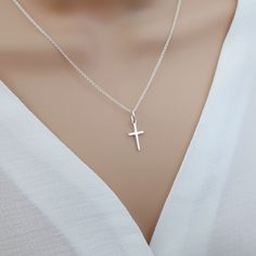 Small cross necklace, sterling silver cross necklace women, cross pendant, religious catholic jewelry, tiny cross necklace Our small cross necklace is super dainty & minimalistic - perfect for layering with other necklaces. Would make the perfect meaningful gift for yourself or someone special.  Explore our gorgeous collection of dainty and personalised necklaces and bracelets. Lovingly handcrafted for you, our beautiful, collectable pieces combine minimalism and personalisation.  https://www.et Small Silver Cross Necklace, Delicate Sterling Silver Cross Pendant Necklace, Dainty Sterling Silver Cross Pendant Charm Necklace, Simple Sterling Silver Cross Pendant Necklace, Minimalist Sterling Silver Cross Pendant Necklace, Silver Cross Necklace Aesthetic, Silver Cross Necklace Woman, Small Cross Necklace, Cross Pendant Men