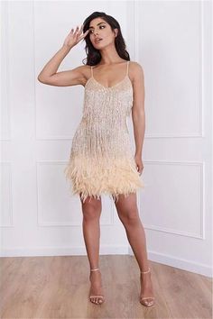 Feather Flapper Dress - Gold Be the life of the party in this roaring 20's vibe ruffle tiered feather mini dress! Champagne Dress, Stitching Dresses, Dress Beige, Panel Dress, Mini Robes, Feather Dress, Asymmetrical Skirt, Gold Dress, Types Of Skirts