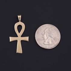 This vintage pendant (circa 1980-1990) features an ankh of 14k gold. The piece measures 1.5 inches from the top of the bail to bottom by 0.7 inches wide, and it is in very good condition. Materials: 14k gold. Gold Brass Ankh Jewelry, Gold Ankh Brass Jewelry, Antique Gold Ankh Jewelry, Vintage Engraved Ankh Jewelry, Egyptian Hieroglyphics Symbols, Ancient Egyptian Hieroglyphics, Ankh Pendant, Egyptian Hieroglyphics, Vintage Pendant