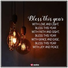 two light bulbs hanging from the ceiling with a message below them that reads, blessing this year