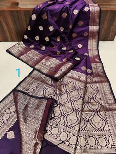 Elevate your ethnic wardrobe with our Exclusive Muga Katan Banarasi Silk Saree, adorned with enchanting All Over Copper Butta weaving. Meticulously handwoven, this saree is a testament to the rich tradition of Banarasi craftsmanship, showcasing the luxurious texture of Muga silk combined with the allure of Katan weave. The intricate Copper Butta motifs, woven with precision, add a regal charm to the saree, making it perfect for special occasions. The resplendent Muga silk drapes gracefully, exuding a lustrous sheen that captivates attention. Included with the saree is a complementary Brocade Blouse Piece, intricately designed to complement the richness of the saree. This ensemble is a blend of traditional artistry and contemporary elegance, ensuring you make a lasting impression at wedding Muga Silk, Banarasi Sari, Katan Saree, Silk Drapes, Brocade Blouse, Brocade Blouses, Banarasi Silk Saree, Indian Heritage, Cultural Events