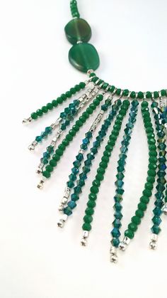 One of a kind long green statement necklace handcrafted with rondel and bicone crystals, silver plated metal beads, green agates and leather. The toggle clasp is stainless steel and it's made with stringing steel cable. It's perfect to highlight your outfit, basic or sophisticated. ❤GIFT WRAPPING: Each product is well packed in a gift bag and box too. ❤IMPORTANT TO KNOW: This piece is one of a kind, that it means, that isn't another piece like that. This is what I love to do: unique pieces for e Leather Statement Necklace, Boho Beaded Necklace, Outfit Basic, Agate Stone Necklace, Green Statement Necklace, Crystal Statement Necklace, Silver Bead Necklace, Agate Necklace, Green Crystal