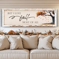 a living room filled with lots of furniture next to a large sign that says, but i love fall most of all