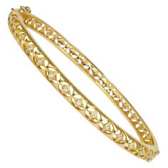 Delicate hand pierced 18k yellow gold and white diamonds lace bangle bracelet. Can be worn both with a casual outfit for an every day look or with a more elegant outfit. Showcasing our designer's signature 18K gold lace, inspired by her childhood memories of lace makers of Normandie and the intricate architecture of Indian palaces, each piece has been hand crafted by our team of expert craftsmen with skills passed down from generations. Made using recycled 18 Karat gold from existing jewellery a Luxury Yellow Gold Engagement Bangle, Indian Palaces, Intricate Architecture, Hand Piercing, Gold Lace, Outfit Casual, White Diamonds, Elegant Outfit, Gold Bangles