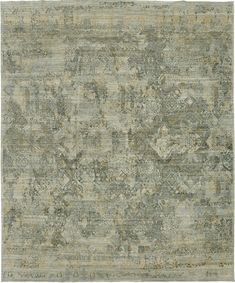 an area rug with many different colors and patterns on the carpet, including grays