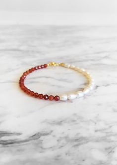 Sea Jewels. This unique piece is inspired by tropical sea creatures. This bracelet is composed of  carnelian gemstones and freshwater pearlσ. So pretty for everyday! It also makes a very cute gift! Available in: ❉ 14K Yellow Gold vermeil ❉ 14K Rose Gold vermeil ❉ 925 Sterling Silver Not sure which length to buy? We can add a 1 inch extender chain. Just write a note at checkout! ❈ We send all our items with registered mail. ❉ Due to the organic nature of stones, there might be a slight variation in colour, size and shape. ✺ All items come packaged in a quality velvet pouch ready for gift giving. ✽ If you want to make a special order, just contact us! Elegant Orange Beaded Bracelets With Gemstones, Elegant Orange Gemstone Beaded Bracelets, Elegant Orange Beaded Bracelet With Natural Stones, Elegant Orange Gemstone Beaded Bracelet, Beaded Orange, Tropical Sea, Rose Gold Pearl, Organic Nature, Bracelet Beaded