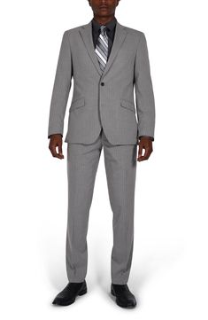 Sleek pinstripes distinguish a suit jacket and pants tailored in a trim fit for refined styling at any occasion. Jacket has notched lapels; four-button cuffs; chest pocket; flap pockets; back vent Lined 69% polyester, 29% rayon, 2% spandex Dry clean Imported Vince Camuto Handbags, Pants Tailored, Trim Fit, Pinstripe Suit, Savile Row, Man Up, Marc Jacobs Bag, Suit Separates, Stuart Weitzman Shoes