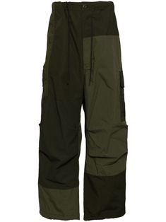 khaki green ripstop texture patchwork design front button and zip fastening elasticated drawstring waistband belt loops two side slash pockets two rear flap pockets drawstring hem straight leg Green Techwear Pants With Multiple Pockets, Green Parachute Pants With Cargo Pockets, Khaki Techwear Pants With Patch Pockets, Green Utility Parachute Pants With Cargo Pockets, Green Techwear Pants With Cargo Pockets, Green Techwear Bottoms With Multiple Pockets, Green Techwear Trousers, Green Parachute Trousers With Side Pockets, Functional Green Cargo Style Pants