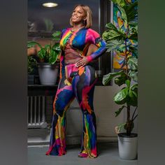 Introducing Our Vibrant, Head-Turning, Multicolor Jumpsuit, Perfect For Those Who Love To Make A Bold Statement. This Features A Crisscross Lace-Up Design And A Body-Hugging Fit That Accentuates Your Curves, Offering Both Style And Comfort. Ideal For Any Occasion Where You Want To Stand Out And Shine. Elevate Your Wardrobe With This Unique Ensemble From Our Boutique, Where Fashion Meets Flair. - Stretch Jumpsuit - Long Sleeve - Lace Up Detail - Back Zipper Closure - Flare Boot - Inseam 34 Inches Multicolor Stretch Long Sleeve Jumpsuits, Multicolor Stretch V-neck Jumpsuits And Rompers, Multicolor Stretch V-neck Bodysuit, Spring Multicolor V-neck Bodysuit, Stretch Jumpsuit, Jumpsuit Long, Long Jumpsuits, How To Look Classy, Long Sleeve Lace