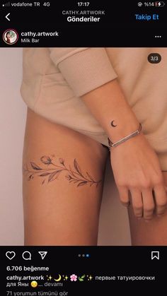 a woman's arm with a tattoo on the left side of her leg and an arrow in the middle