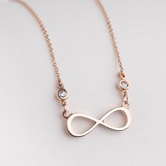 "Buy a unique Infinity necklace in 14 karats gold for women. | Discover a large collection of everyday sparkling jewels. | ✅ We offer FREE Worldwide Shipping. Infinity Forever Design necklace with sparkling CZ stones in rose gold. The modern design allows the sentiment of the necklace to really shine through. Every time you offer someone an infinity-shaped pendant you are indicating that your friendship/love will have no end and will go on forever. It really has a powerful message and sure it wi Long Distance Family Gifts, Bestie Necklace, Bff Gift Ideas, Infinity Symbol Necklace, Gold Infinity Necklace, Infinity Necklace Gold, Simple Necklace Everyday, Eternity Symbol, Unbiological Sister