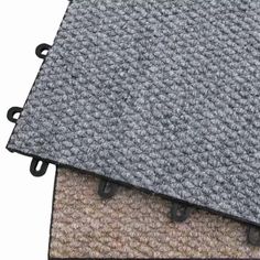 two carpet mats with black handles on each side and one gray floor mat in the middle