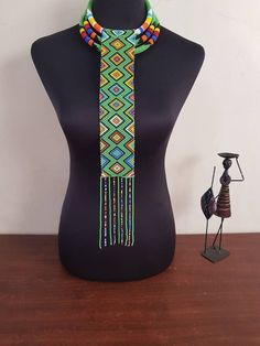 This set is perfect for weddings, traditional events , African themed events etc. *This set makes a perfect gift. In this listing, you will get both necklaces like shown above. *Long pendant necklace. *2 in 1 necklace. Custom orders are welcome. More neckleces here; https://www.etsy.com/shop/TribalTess?ref=seller-platform-mcnav&section_id=21306083 Back to my shop; https://www.etsy.com/shop/TribalTess?ref=seller-platform-mcnav Handmade Elegant Beads For Festivals, Elegant Handmade Beads For Festivals, Elegant Handmade Beaded Necklaces For Festivals, Bohemian Handmade Beaded Necklaces For Traditional Ceremonies, Beaded Necklaces For Festivals And Gifts, Beaded Necklaces For Festivals As Gifts, Necklace With Colorful Round Beads For Traditional Ceremonies, Traditional Handmade Beaded Necklaces For Ceremonies, Multicolor Beaded Chain Necklace For Wedding