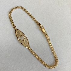 Up for sale is this vintage estate 14 karat solid yellow gold 7" heart cut-out diamond cut ornate filigree 1/8" wide link chain bracelet.  The piece features a diamond cut heart shape cut-out in the center of the filigree center.  The links portion of the bracelet measures approximately 1/8" (3mm) wide.  The bracelet measures 7" long and closes with a lobster claw clasp.  The piece weighs 3.2 grams.  Both end tags are marked 14K ITALY.  Note that some photos are enlarged to show details. Buy wit Gold Filigree Bracelet In 14k Gold, 14k Gold Filigree Bracelet, 14k Gold Filigree Bracelets, Yellow Gold Filigree Jewelry For Valentine's Day, 14k Gold Bracelet With Intricate Design For Gift, Vintage Gold Heart Bracelet For Anniversary, Valentine's Day Yellow Gold Jewelry With Intricate Design, Gold Filigree Oval Link Jewelry, Yellow Gold Filigree Bracelet For Anniversary