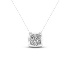 Amp up the sparkle volume with this dazzling cushion-shaped diamond pendant. Crafted in cool 10K white gold, this petite design features a 1/15 ct. diamond at the center of a shimmering composite. A polished frame completes this spellbinding look. Radiant with 1/3 ct. t.w. of diamonds and a brilliant buffed luster, this dainty pendant suspends along an 18.0-inch rope chain that secures with a spring-ring clasp. Dainty Pendant, Rope Chain, Diamond Clarity, Diamond Stone, White Metal, Stone Settings, Necklace Designs, Spring Rings, Diamond Pendant