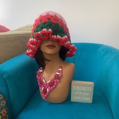 This crochet Pink, Green, and Red Granny Stripe Ruffle bucket Slouch hat is part of our ruffle collection and features a cute Ruffle design on the bottom, It also includes a faux Leather name tag with a gem rivet this hat With a head circumference of 21-25 inches, it is made from 3 cotton yarns for the base and brim, and the ruffles, Whether you're looking to add some flair to your outfit or need a hat for a day at the beach, this is the perfect choice! If you would prefer a different color combination, please feel free to message us. Thank you for visiting My store! Necklace not included just a prop  More colors coming in this design Granny Stripe, Crochet Pink, Crochet Ruffle, Ruffle Design, Slouch Hat, Cotton Crochet, Green And Red, Head Circumference, Color Combination