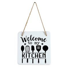 a sign that says welcome to my kitchen hanging from a rope on a white wall