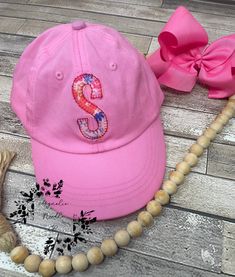 Girls monogrammed hat, Girls appliqué letter hat, floral monogrammed hat, girls hat, girls baseball cap, girls ball cap This is a blush pink ball cap with a beautiful floral one letter monogram! Perfect for those growing toddlers to use for years! Special note from seller Hi, Thank you so much for your business and support of our passion to create custom designs for you! Please know it is our goal to give you the best quality and service we can!  IF YOU NEED THIS SHIPPED OUT FOR SURE WITHIN 2 DAYS PLEASE ADD THE RUSHED ORDER FEE SO THAT IT CAN BE MOVED TO THE FRONT OF MY ORDERS. I SOMETIMES DONT SEE MESSAGES OR COMMENTS ABOUT NEEDING THEM QUICKER SO THIS IS THE ONLY WAY I KNOW TO MAKE SURE IM AWARE!  It is our policy however, due to the personalized nature of our items that we do not do ex Cute Personalized Baseball Cap With Curved Brim, Personalized Cute Baseball Cap With Curved Brim, Personalized Pink Cap, Pink Curved Brim Hat Personalized, Personalized Pink Snapback Hat, Personalized Pink Baseball Cap, Pink Adjustable Hat With Letter Embroidery, Pink Adjustable Baseball Cap With Letter Embroidery, Pink Hat With Letter Embroidery And Curved Brim