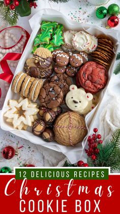 christmas cookie box filled with cookies, cookies and other holiday treats on top of a table