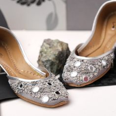 "--- FREE SHIPPING on each additional pairs when you pay for your first pair of shoes --- --- Wide feet? Not an issue. We offer choices for individuals with broader foot dimensions. Please contact us to discuss sizing details before placing your order ---   * Dove grey dull shine base with mirror work and silver embellishments on flat shoes.  * Cushioned Insole. * Leather Out sole. * Easy and comfortable to wear. * Perfect for every occasion. * Best in quality. * Handmade. Please choose your siz Hand Embellished Heels For Reception, Festive Hand Embellished Heels For Wedding, Hand Embellished Heels For Wedding And Festive Occasions, Festive Closed Toe Wedding Shoes For Party, Festive Closed-toe Wedding Shoes, Zari Work Wedding Shoes For Festivals, Wedding Shoes With Zari Work For Festivals, Festive Zari Work Wedding Shoes, Zari Work Wedding Shoes