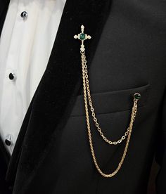 The perfect formal wear accessory. This elegant chain lapel and gemstone brooch pin set features a dazzling chain and a luxurious gemstone brooch  that add that perfect touch of dapper to your entire look.  This piece is a welcome addition to refine your over-all aesthetic. Luxury Gold Lapel Pin For Party, Elegant Chain Lapel Pin For Formal Occasions, Gold Brooches With Chain For Party, Gold Chain Brooches For Party, Gold Chain Brooch For Party, Elegant Lapel Pin With Chain As Gift, Elegant Gold Lapel Pin For Party, Gold Party Brooch With Chain, Elegant Formal Lapel Pin With Chain