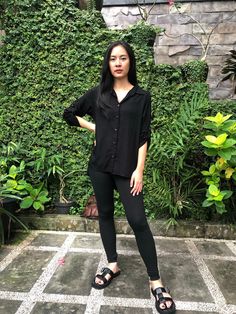 A nice breathable Black Rayon Button Shirt Top, perfect for all seasons.  This Black Rayon Long Sleeve Button Up Top is a good to pair with shorts, denim, skirt, jeans, legging and long pants.  An easy button shirt blouse to put on for casual to formal events. You can easily wear this top for work by pairing it with skirt or jeans.  For casual looks, just rolled up the long sleeves and secured it by tab and button.  This collar blouse also can be wear as an outerwear by pairing it with dresses or over a tank top.  This item is handmade in Bali Measurements : SMALL (S) Length from High Point Shoulder  :  25 1/2 inches  Bust                                                : 37 inches Waist                                              : 37 inches Shoulder seam to seam               : 14 inches Versatile Long Sleeve Button Blouse, Versatile Long Sleeve Blouse With Buttons, Versatile Collared Blouse With Buttons, Black Blouse With Shirttail Hem For Daywear, Versatile Solid Color Blouse With Shirttail Hem, Versatile Solid Blouse With Shirttail Hem, Versatile Black Blouse For Daywear, Versatile Button-up Shirt, Black Blouse With Button Closure And Shirttail Hem