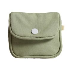 a green pouch with a white button on it