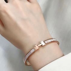 These Are Highly Polished Fashion Titanium Stainless Steel Rose Gold Plated Pieces That Will Last A Lifetime. It Is Corrosion And Scratch Resistant And Hypoallergenic. The Bangle Is An Oval Shape That Sits Perfectly On The Wrist With The H Or Always On Top. The H/Front Are Set In A White Mother Of Pearl Style Tone. Outside Circumference Of Bracelet Is Approximately 19cm Brand New Rose Gold Tone Color Rose Gold Bracelets Fashion Accessory, Trendy Rose Gold Bracelets For Wedding, Trendy Rose Gold Wedding Bracelets, Polished Fashion, Rose Gold Bangle Bracelet, Rose Gold Bangle, Gold Bangle Bracelet, Gold Bangle, Steel Plate