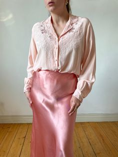 Beautiful pink vintage silk hand embroidered long sleeve blouse.  Made out of very pleasant silk fabric. Truly elegant and a very rare find.  -100% pure silk -tag size:  40 -label: peony, made in shanghai Circa: 50s Best fits: S - M Condition: overall superb, no marks under armpits, very light marks at the back, on the sleeve but barely noticeable  MEASUREMENTS *taken seam to seam. not doubled, taken flat Shoulders: 45 cm | 17.7" Bust: 52 cm | 20.4" Sleeve length: 57 cm | 22.4" Length: 56 cm | 2 Feminine Blouse With Floral Embroidery For Daywear, Feminine Floral Embroidery Blouse For Daywear, Floral Embroidery Long Sleeve Blouse For Daywear, Long Sleeve Blouse With Floral Embroidery For Daywear, Feminine Blouse With Floral Embroidery For Wedding, Elegant Embroidered Pink Blouse, Elegant Pink Embroidered Blouse, Feminine Wedding Blouse With Floral Embroidery, Feminine Long Sleeve Embroidered Blouse