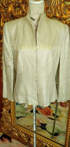 "This is one stunning jacket from the 60's by Marie St. Claire! Made of pale gold satin embroidered with a brighter gold half circle pattern. Scattered through out are silver bugle beads. The buttons are gorgeous being clear faceted 3D lucite. Lined in a beaige satin fabric. Excellent condition! Best fit would be a Medium/Large, however, please see the measurements below for a proper fit. All sales are final. Measurements Armpit-armpit doubled 40\" Sleeve 22\" Shoulder 16.5\" Length 25\"" Flapper Party, St Claire, Evening Jacket, Flapper Style, Evening Jackets, Gold Satin, Black Velvet Dress, Bugle Beads, Half Circle