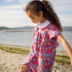 The Fae dress is a sweet straight cut dress with a gentle drape and front buttons. It features a broad collar in a white eyelet fabric and short sleeves with a slight puff. The dresses this season are in the signature bright prints in pink and yellow, both of which create a striking contrast and look lovely with the broderie collar. | Beet World | Fae Broad Collar Straight Cut Dress, Orchid (Multicolor, Size 12-18M) | Maisonette collects the best children’s products from around the world (unlike Cute Collared Summer Dress, Cute White Collared Dress, Summer Dresses With Peter Pan Collar For Garden Party, Summer Garden Party Dress With Peter Pan Collar, Summer Garden Party Dresses With Peter Pan Collar, Short Sleeve Dresses With Buttons, Playful Doll Collar Dresses For Spring, Playful Spring Dress With Doll Collar, Playful Summer Dress With Doll Collar